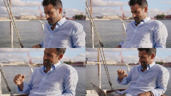 企业家在他的帆船上进行视频通话