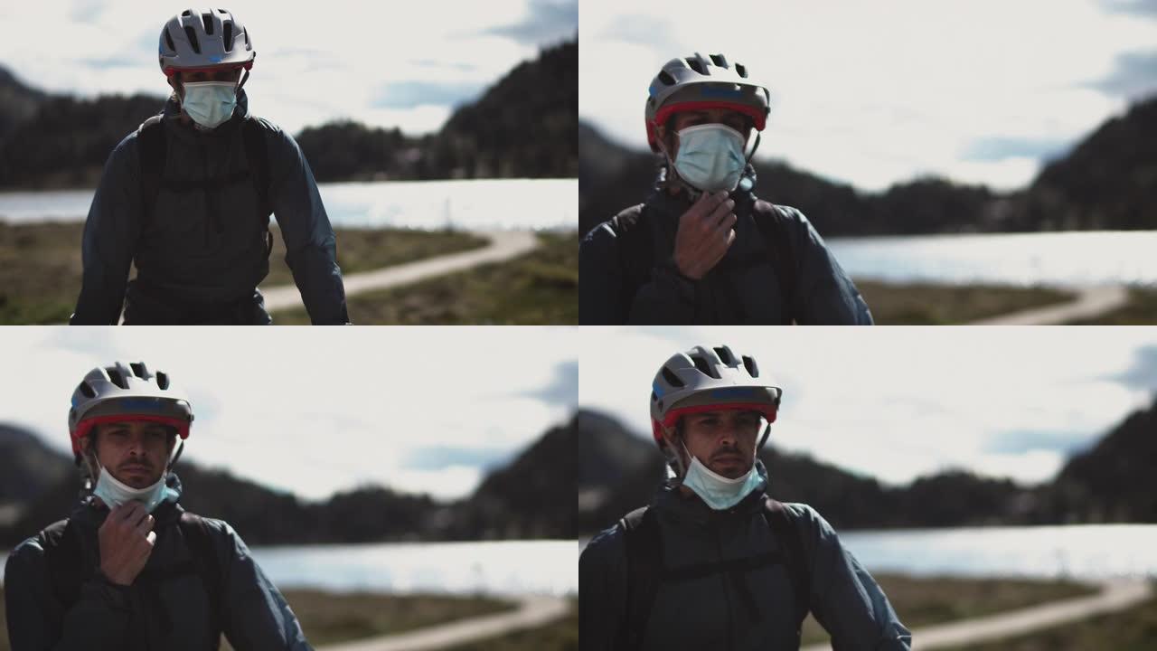 新型冠状病毒肺炎期间戴防护面具骑自行车的人