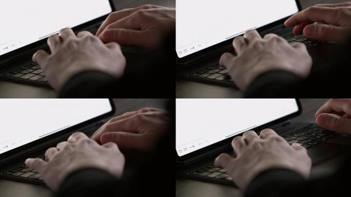 双手在黑色优雅的笔记本电脑上慢动作打字的特写镜头