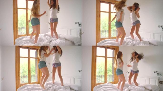 两个女性朋友在床上一起跳舞的4k视频片段
