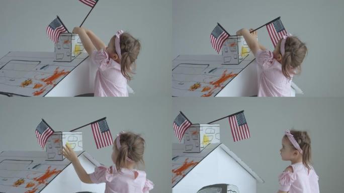 玩美国国旗玩具屋的女婴，慢动作