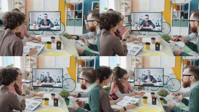 年轻商人在与办公室同事的在线视频会议上讲话和打手势