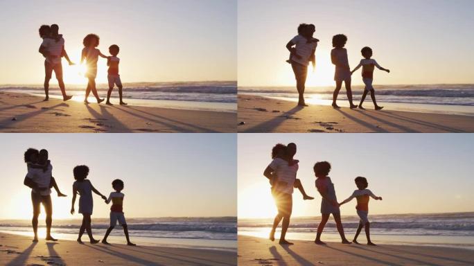 日落时分在海滩上一起散步的非裔美国人家庭