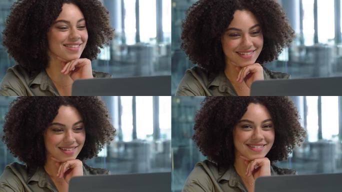 4k视频片段，一名年轻女子在办公室微笑并工作