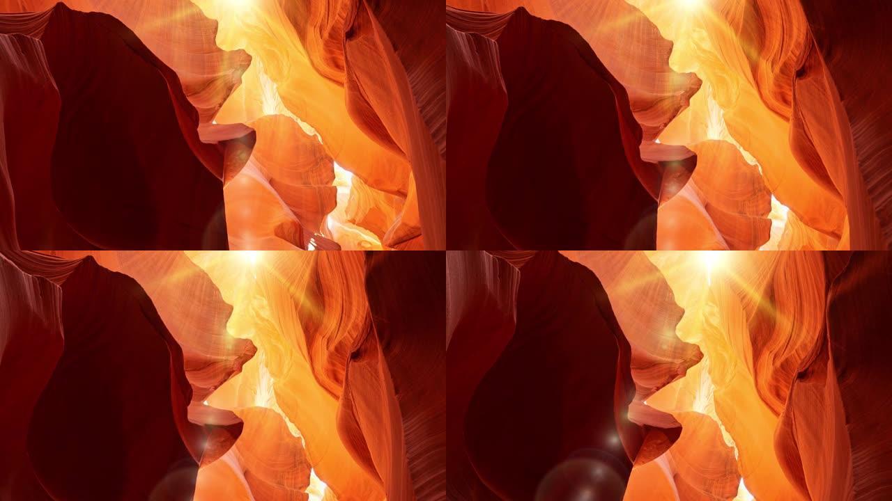 羚羊峡谷中的各种红色和橙色岩石。正午的阳光照在羚羊峡谷上，异想天开地照亮了峡谷的墙壁。美国亚利桑那州