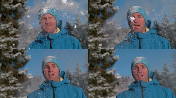 肖像，dop: 斜视的男性游客被蓬松的雪球击中。