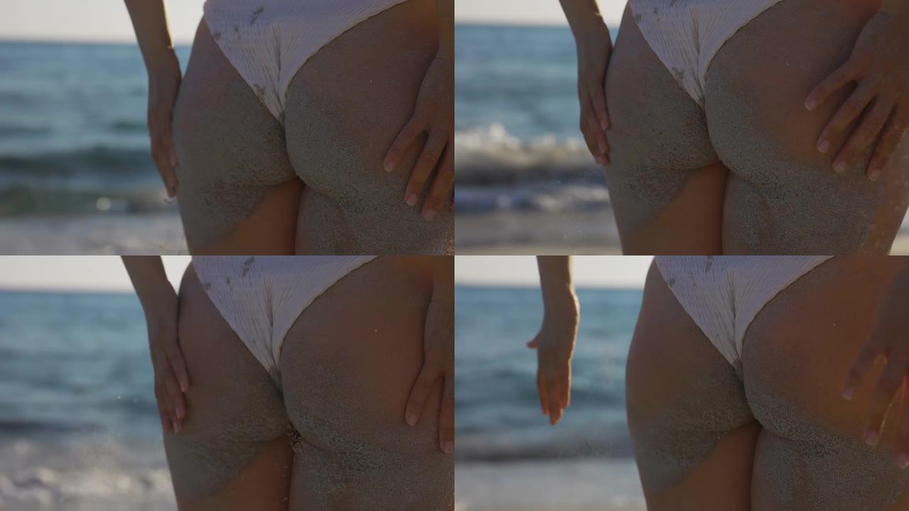 海滩上女人背的慢动作视图。