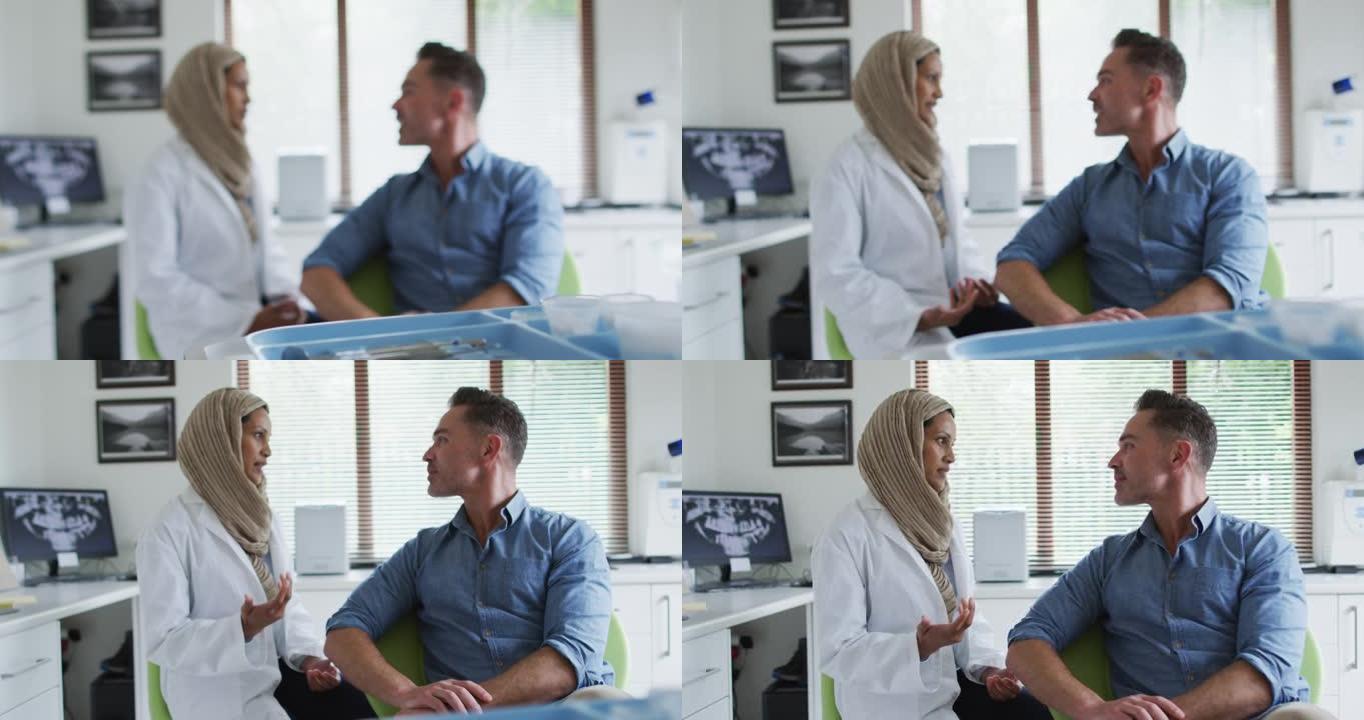 混血儿女牙医在现代牙科诊所与男性患者交谈