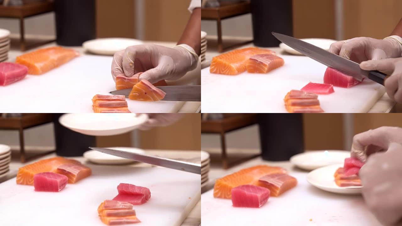 4K UHD慢动作手持: 关闭厨师的手切生鲑鱼和金枪鱼，作为生鱼片，日本鸡鸡料理。