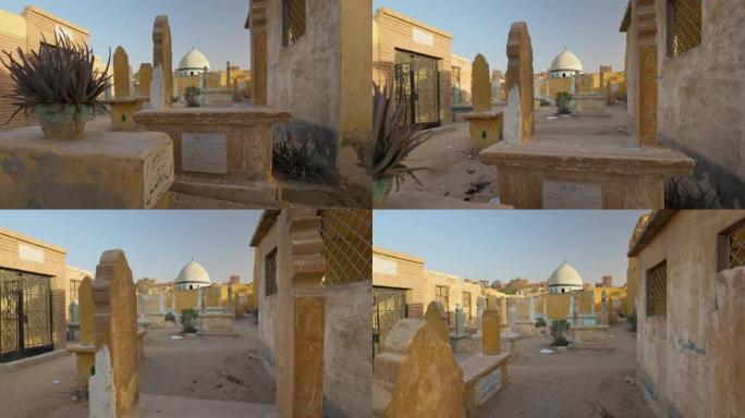 死者之城或开罗墓地-卡拉法-埃及开罗的墓地。摄像机在墓碑上移动，万向节拍摄