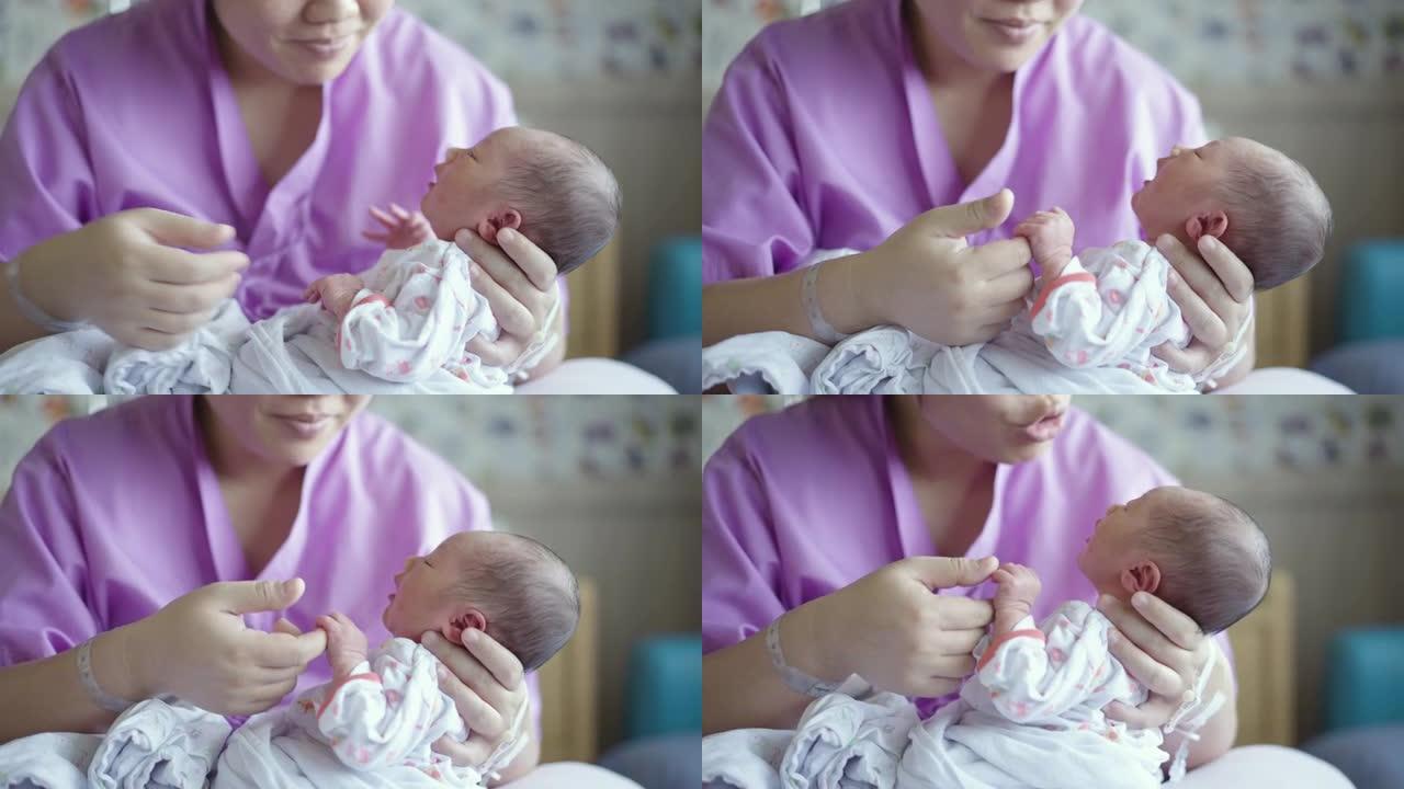 女性父母杯在医院分娩后喂养新生婴儿