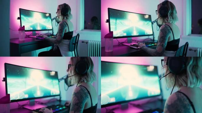 女性流光者在她的电脑上玩游戏