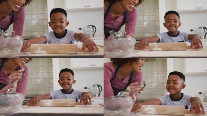 非裔美国母亲和儿子在家里的厨房里一起烘烤
