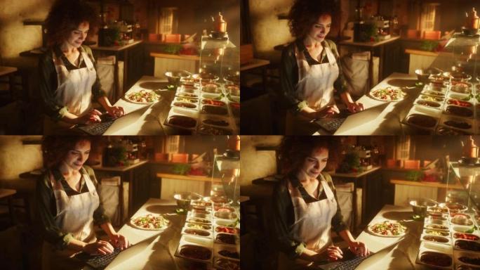 在餐厅: 美丽的女厨师使用笔记本电脑。正宗的比萨店，配有美味的有机生态食品。在她的小型企业家庭商店工
