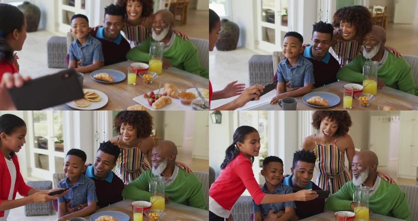 非裔美国女孩在家里和家人吃早餐时自拍