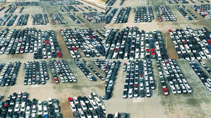 汽车工厂停车场新车的鸟瞰图。汽车，汽车经销商停车场。