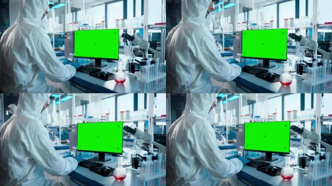 医学实验室: 微生物科学家穿着无菌工作服，面罩和面罩在绿色色度键屏幕上工作计算机开发疫苗，药物和抗生