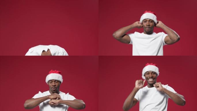 一个穿着白色t恤的黑皮肤男子潜入柜台下，然后戴着圣诞帽站起来