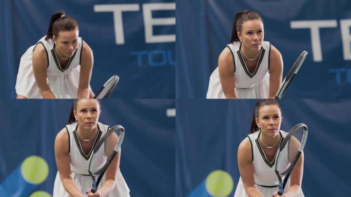 女子网球运动员在锦标赛期间手持球拍的Potrait，准备接受击球。自信的竞技职业女运动员。电视频道的