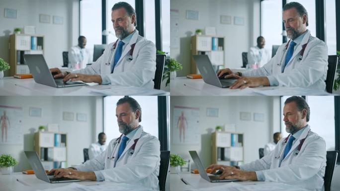 幸福家庭医生正在一家诊所的笔记本电脑上工作。穿着白大褂的医生正在医院办公室的桌子后面浏览病史。