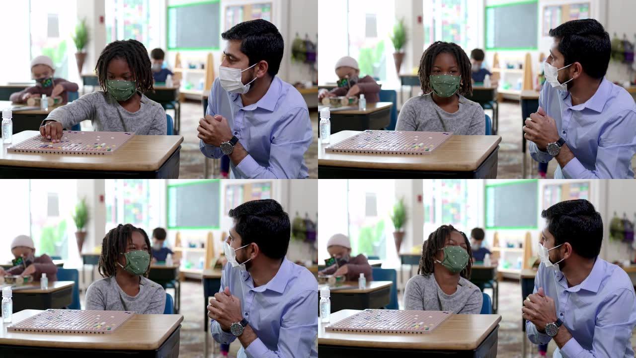 新型冠状病毒肺炎期间蒙面学生在教室里
