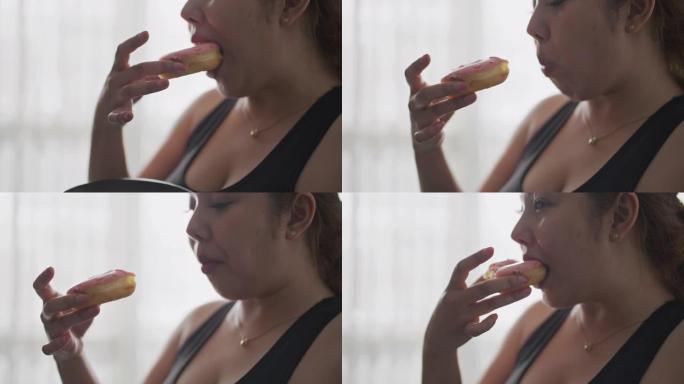超重的女人喜欢吃甜甜圈
