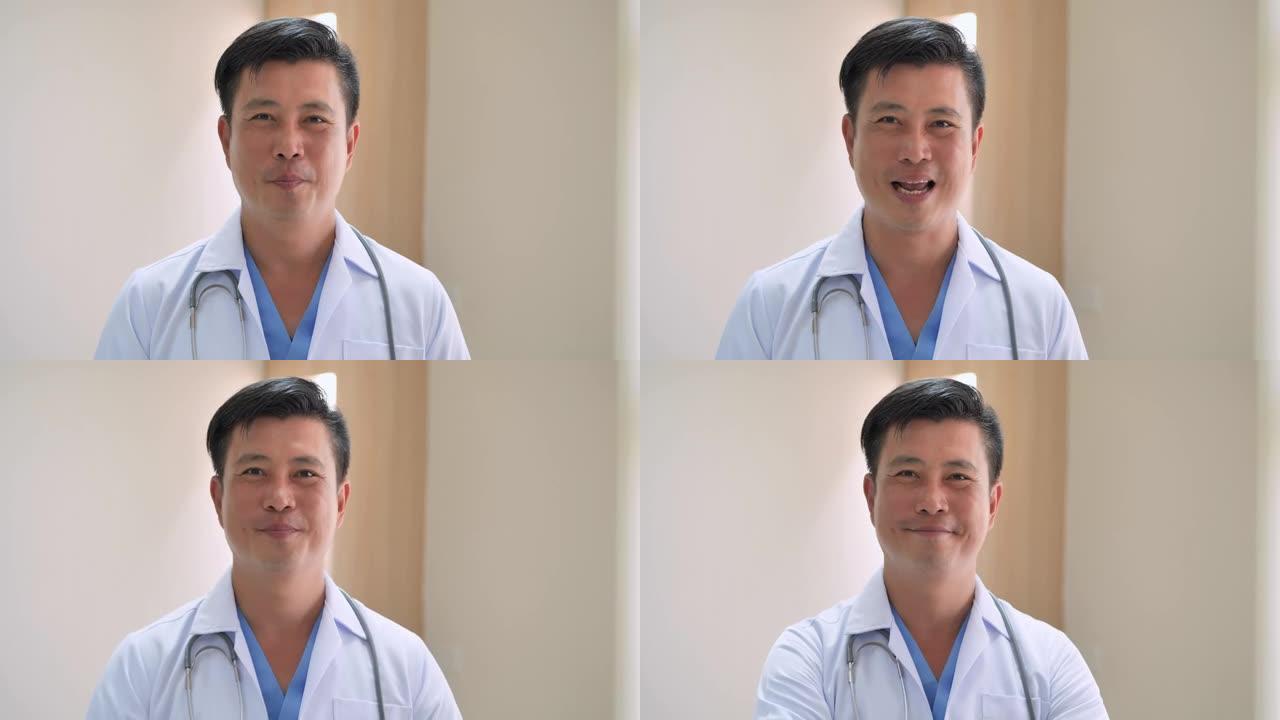 肖像亚洲医生男性经验丰富的医生微笑着看着镜头。多样化的医学肖像概念。