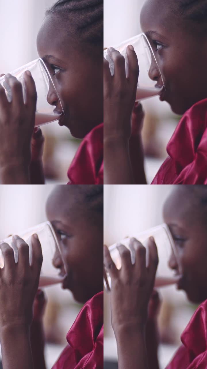 特写: 非洲女孩喝牛奶