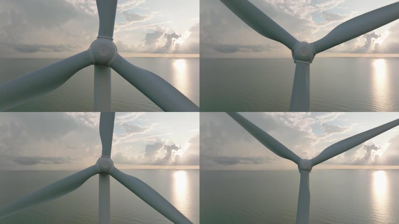日落或早晨的鸟瞰图，可以看到海洋中的风力涡轮机，可再生能源，清洁可再生绿色风力发电。经典能源概念。