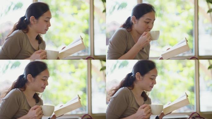 女人看书放松白领看书喝咖啡