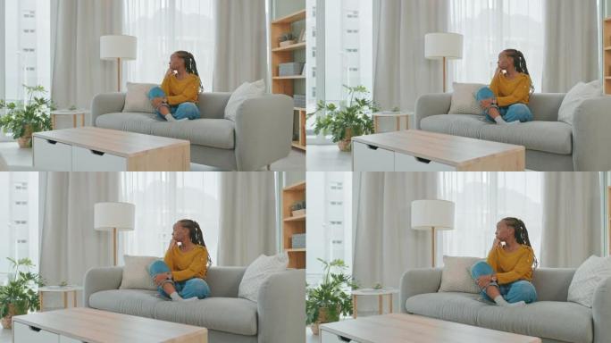 4k视频片段，一名年轻女子坐在家里的沙发上