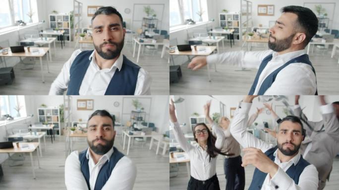 快乐的商人看着相机跳舞，然后同事们跑去扔钱玩得开心