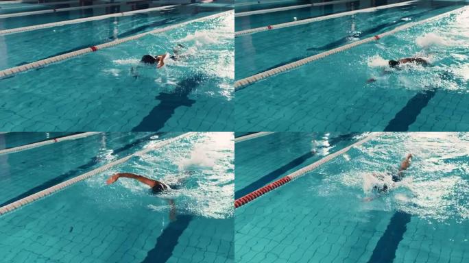 美丽的女游泳者使用前爬行，在游泳池自由泳。立志夺冠的职业运动员。电影慢动作，时尚的色彩，艺术跟踪宽镜