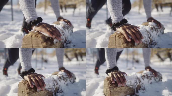 男子在雪地里做俯卧撑