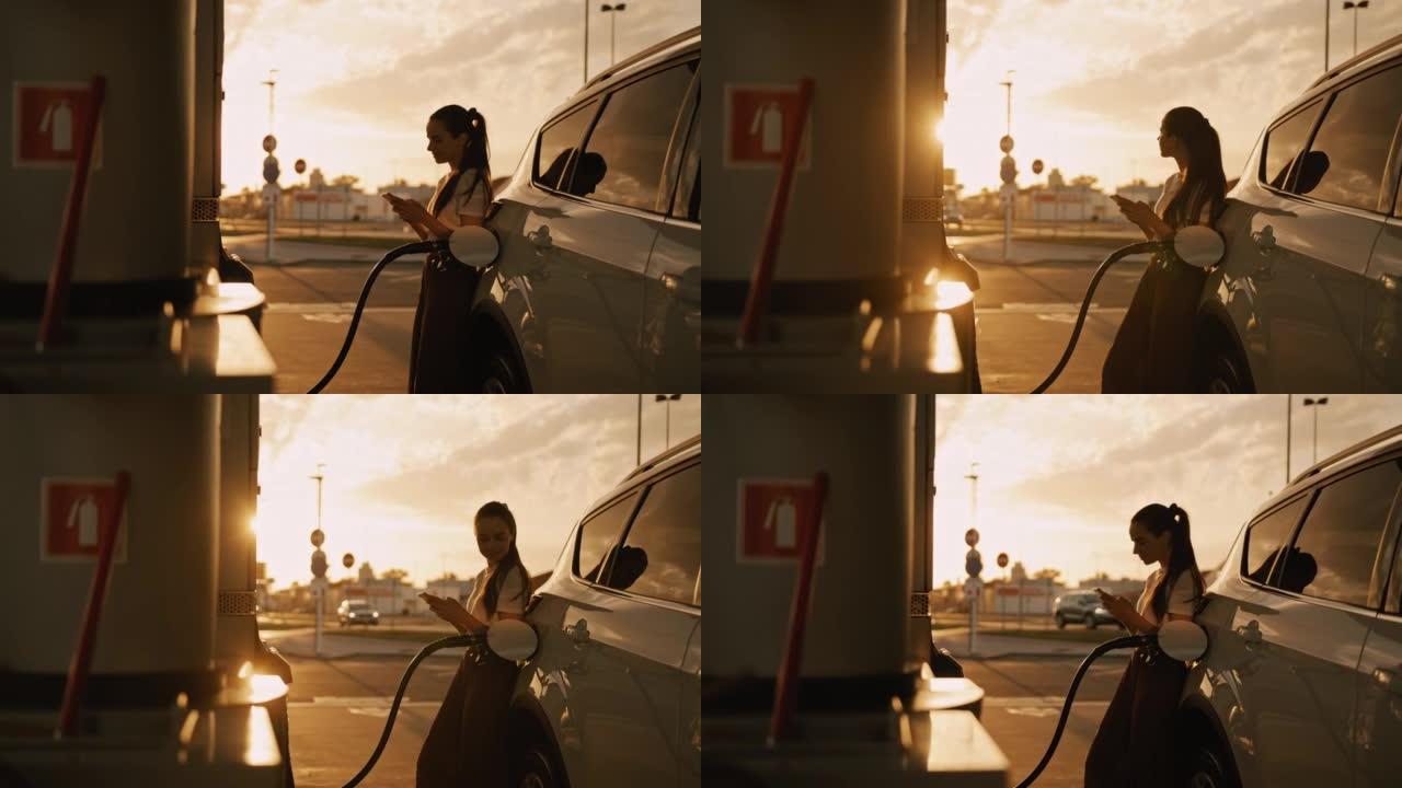 日落时加满汽车油箱的SLO MO年轻女子在电话中