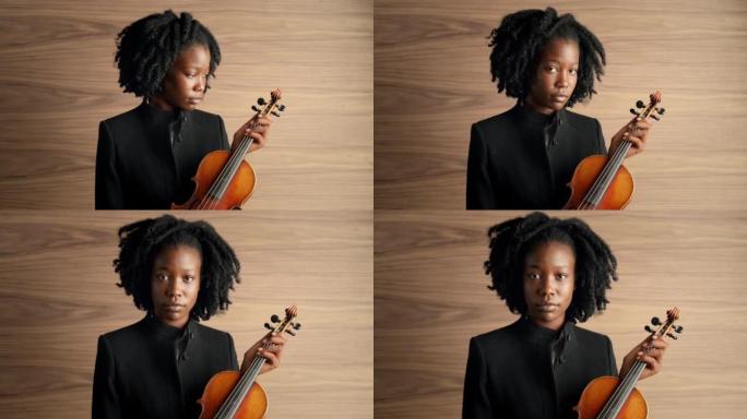 一名年轻女子拉小提琴的4k视频片段