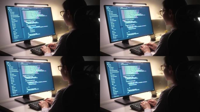 女程序员晚上在办公室的办公桌上写开发代码