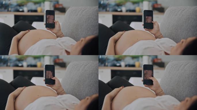 DS孕妇在智能手机上查看未出生婴儿的超声波扫描