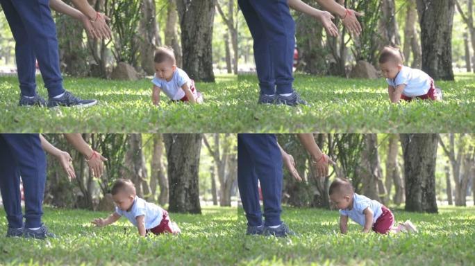 小男孩爬行并试图踏上草地，慢动作