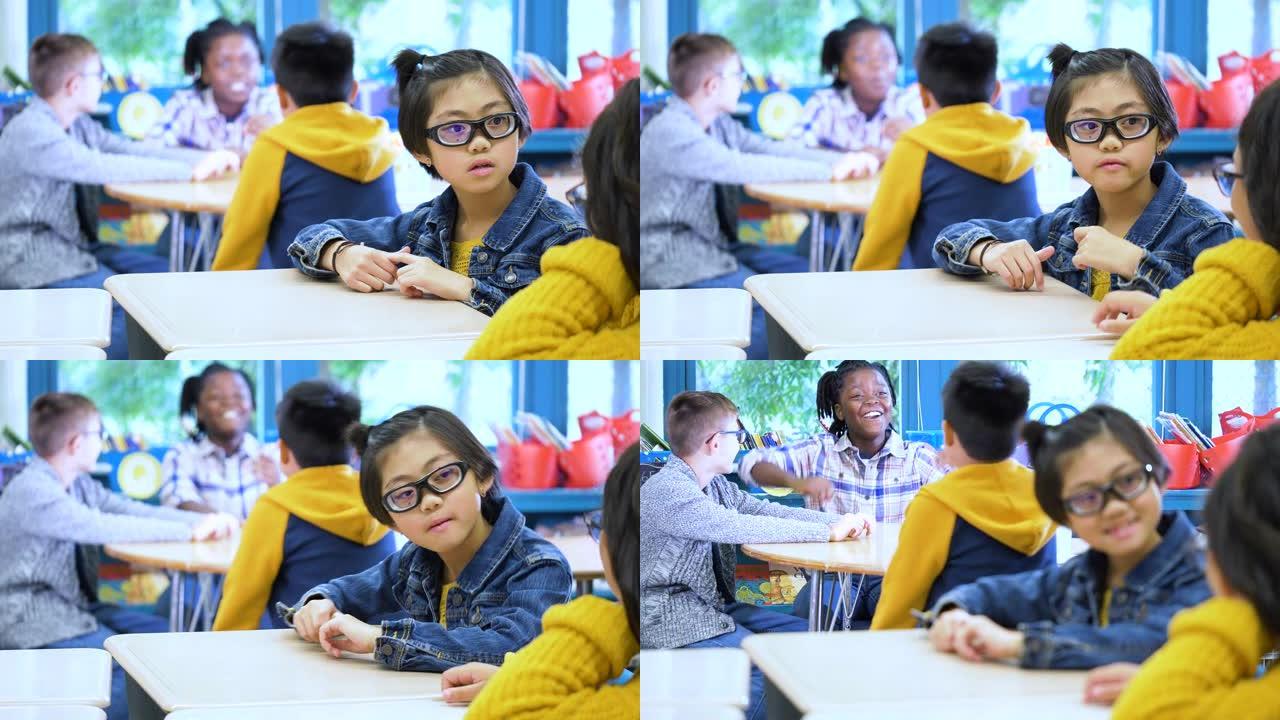 多种族儿童在小学教室里讲话