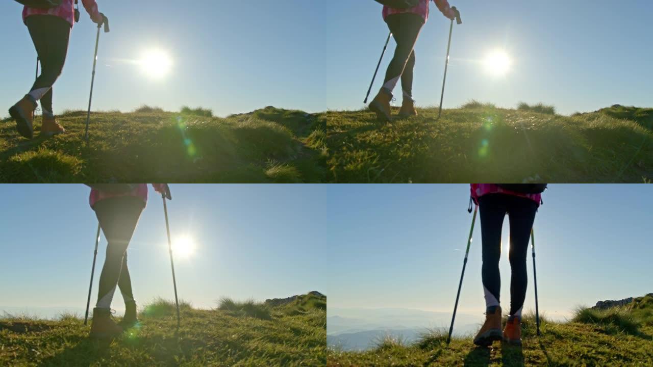 SLO MO年轻女子在山脊上行走时使用拐杖