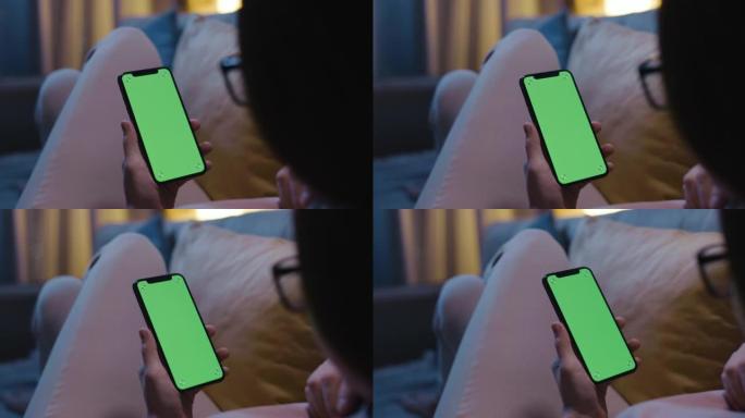 女人晚上使用手机绿屏