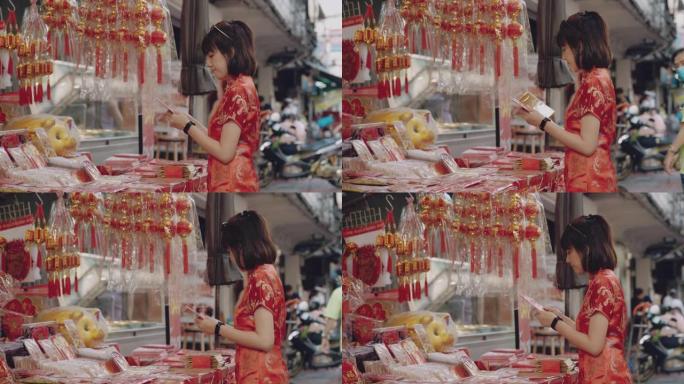 春节购物红色旗袍新年装饰视频素材