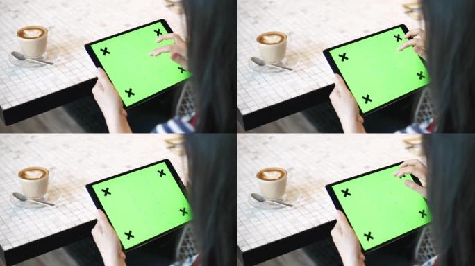 在咖啡馆使用数字平板电脑绿屏