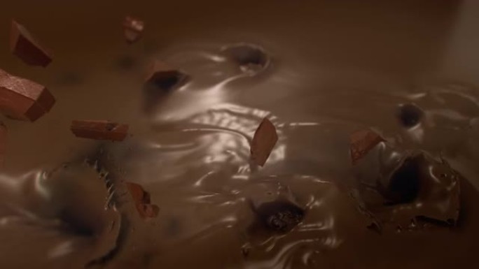 在4k超级慢动作中，巧克力碎片落入液体巧克力中