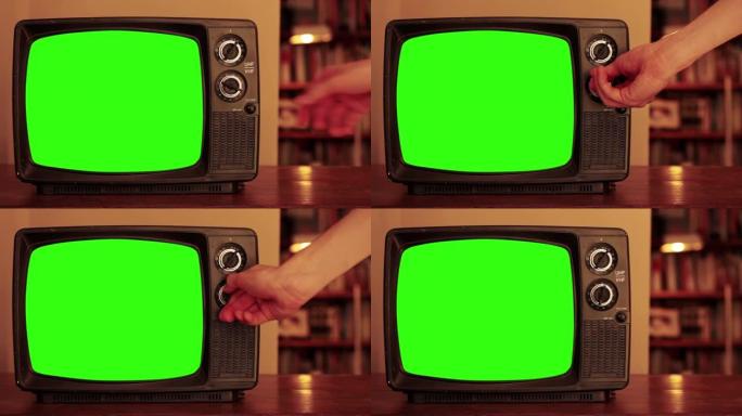 在带有绿色屏幕的旧电视中，手动移动拨盘。4k分辨率。