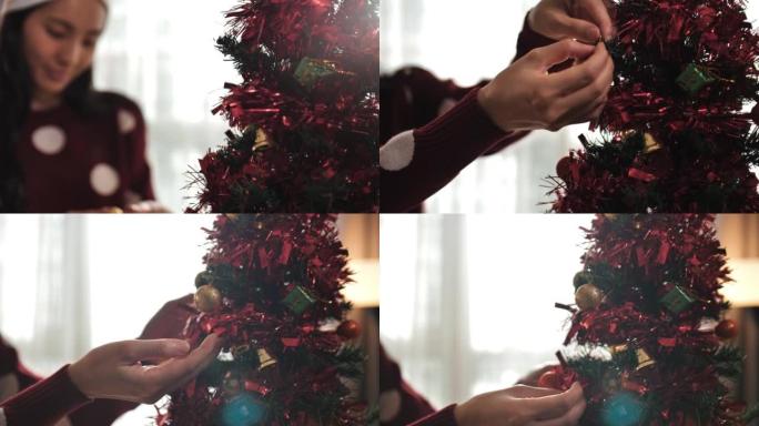 双手用球形玩具装饰圣诞节或新年树