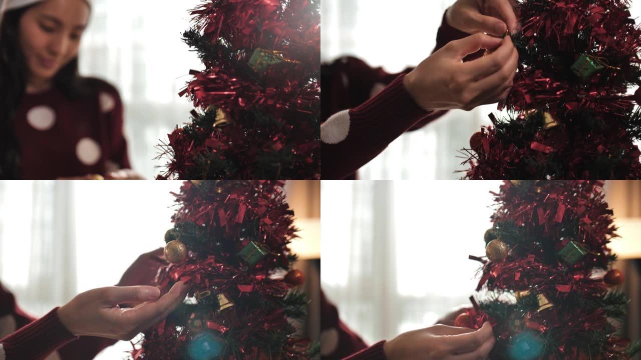 双手用球形玩具装饰圣诞节或新年树