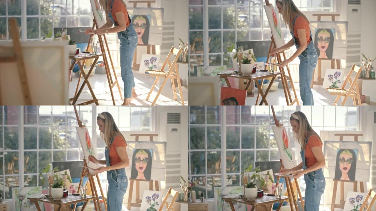 创意女艺术家在她的家庭艺术工作室在木制调色板上混合油或丙烯酸涂料。年轻的艺术画家准备在画架上的画布上