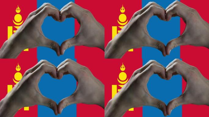 双手在蒙古国旗上显示心形标志。